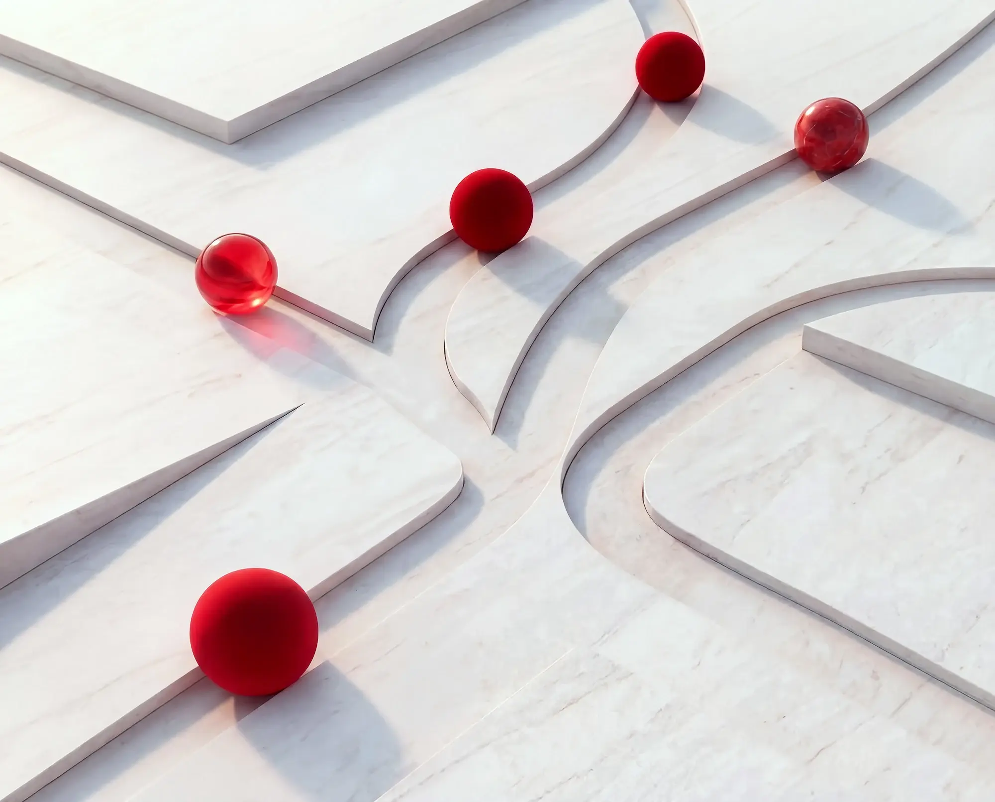 A cluster of red balls arranged on a clean white surface, showcasing their vibrant color contrast